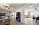 Open living room with fireplace, neutral walls, and tile floors. Opens to kitchen dining area at 1925 Old Parsonage Rd, Charleston, SC 29414
