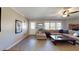 Living room featuring tile flooring, neutral paint, ceiling fan, and access to windows at 1925 Old Parsonage Rd, Charleston, SC 29414