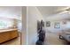 Open-concept living room and kitchen with tile flooring, and natural light, offering a welcoming and functional space at 1925 Old Parsonage Rd, Charleston, SC 29414