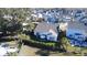 Overhead view of a gray-roofed home with an umbrella-covered patio, set in a neighborhood with lawns and trees at 2009 Utsey St, Johns Island, SC 29455