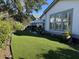 Lush backyard with well-maintained artificial turf, patio furniture, and elegant landscaping at 2009 Utsey St, Johns Island, SC 29455