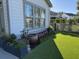 Beautifully landscaped backyard featuring artificial turf, mature plantings, and elegant garden beds at 2009 Utsey St, Johns Island, SC 29455