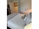 Comfortable bedroom with a neutral color palette with walk-in closet and full bathroom at 2009 Utsey St, Johns Island, SC 29455