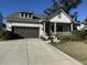 A single-Gathering house with a two-car garage and a concrete driveway is surrounded by landscaping at 2009 Utsey St, Johns Island, SC 29455