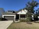 Charming single Gathering home with two-car garage, manicured lawn, and inviting front porch at 2009 Utsey St, Johns Island, SC 29455