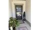 Entryway featuring a black front door, decorative mat, and a vibrant plant to greet guests at 2009 Utsey St, Johns Island, SC 29455