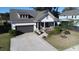 View of home featuring a well manicured lawn and a 2 car garage at 2009 Utsey St, Johns Island, SC 29455