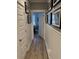 Hallway showcases elegant wood floors, beadboard accents, and a peek into a beautifully decorated room at 2009 Utsey St, Johns Island, SC 29455