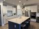 Well-lit kitchen with stainless steel appliances and large kitchen island at 2009 Utsey St, Johns Island, SC 29455