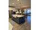 Modern kitchen island with a sink, stainless steel appliances, and an open layout at 2009 Utsey St, Johns Island, SC 29455