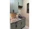 Well-equipped laundry room featuring granite countertops, modern fixtures, and ample cabinet space at 2009 Utsey St, Johns Island, SC 29455