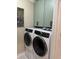 Efficient laundry area featuring modern washer and dryer units with ample space and sleek cabinetry at 2009 Utsey St, Johns Island, SC 29455