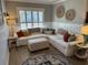 Inviting living room featuring a cozy sectional, plush ottoman, and natural light at 2009 Utsey St, Johns Island, SC 29455