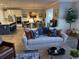 Open-concept living space with a sofa and view of the kitchen and dining area at 2009 Utsey St, Johns Island, SC 29455