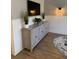 Featuring built-in storage, the living room is decorated in neutral tones and has a large TV at 2009 Utsey St, Johns Island, SC 29455