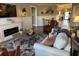 Cozy living room with a fireplace, plush sofa, and area rug at 2009 Utsey St, Johns Island, SC 29455