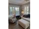 Bright living room features white couches, wood flooring and shuttered windows at 2009 Utsey St, Johns Island, SC 29455