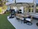 Outdoor dining area featuring a table, six chairs, and a sun umbrella in a well manicured backyard at 2009 Utsey St, Johns Island, SC 29455