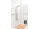 Bright bathroom featuring a sleek, modern shower system with a rainfall showerhead and a stylish woven stool at 204 E Huron Ave, Folly Beach, SC 29439