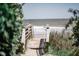 Inviting beach access with wooden stairs leading down to the serene ocean shore at 204 E Huron Ave, Folly Beach, SC 29439