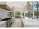 Modern kitchen with white countertops, stainless steel appliances, and an open design concept at 204 E Huron Ave, Folly Beach, SC 29439