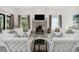 Bright living room with a fireplace, white shiplap walls, and neutral tones at 204 E Huron Ave, Folly Beach, SC 29439