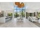 A spacious living room features high ceilings, large windows, and an open floor plan at 204 E Huron Ave, Folly Beach, SC 29439