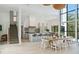 Inviting living space with sleek kitchen, dining area, and staircase in a bright, open layout at 204 E Huron Ave, Folly Beach, SC 29439