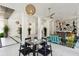 Stylish lobby featuring a glass table, ceiling fan, decorative wall art, and an open seating area at 204 E Huron Ave, Folly Beach, SC 29439