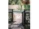 A charming view of a backyard pool area, framed by a decorative gate and lush greenery at 204 E Huron Ave, Folly Beach, SC 29439