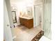 Bathroom with double sink vanity, large mirror, and access to the shower/tub, offering convenience at 2049 Maybelles Ln, Charleston, SC 29414