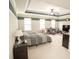 Bright main bedroom with large windows, ceiling fan, neutral carpet, comfortable seating, and a tv at 2049 Maybelles Ln, Charleston, SC 29414