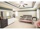 Large main bedroom with neutral carpet, ceiling fan, plenty of natural light, and comfortable furniture at 2049 Maybelles Ln, Charleston, SC 29414