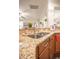 Stylish kitchen sink with granite countertops and a view to the living area at 2049 Maybelles Ln, Charleston, SC 29414