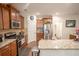 Well-equipped kitchen with modern appliances, dark wood cabinets, and granite countertops at 2049 Maybelles Ln, Charleston, SC 29414