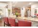 Eat-in kitchen bar with granite countertops and red stools, offering ample counter space at 2049 Maybelles Ln, Charleston, SC 29414