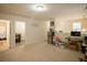 Bright and airy living room with carpet floors and natural light, offering a flexible living space at 2049 Maybelles Ln, Charleston, SC 29414