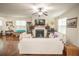 Bright living room features neutral tones, white couches and a cozy fireplace at 2049 Maybelles Ln, Charleston, SC 29414