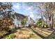 Expansive backyard featuring mature trees and a deck, creating a serene and private outdoor oasis at 2050 S Smokerise Way, Mount Pleasant, SC 29466