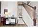 Welcoming foyer with hardwood floors, staircase, and a view into the living room creates an inviting entrance at 2050 S Smokerise Way, Mount Pleasant, SC 29466