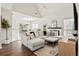 Bright living room with vaulted ceilings, a fireplace, and an open layout, featuring hardwood floors at 2050 S Smokerise Way, Mount Pleasant, SC 29466