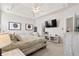 Comfortable main bedroom with a tray ceiling, a large bed, and ample natural light, creating a serene atmosphere at 2050 S Smokerise Way, Mount Pleasant, SC 29466