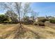 Large backyard with mature trees, offering plenty of space for outdoor activities at 2052 Bancroft Ln, Mount Pleasant, SC 29466