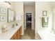 Bright bathroom features a double sink vanity and access to the walk-in closet at 2052 Bancroft Ln, Mount Pleasant, SC 29466