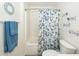 This bathroom features a tub with a shower and blue towels at 2052 Bancroft Ln, Mount Pleasant, SC 29466