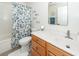 This bathroom features a tub with a shower, a vanity, and a mirror at 2052 Bancroft Ln, Mount Pleasant, SC 29466