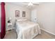 Comfortable bedroom features neutral tones, a ceiling fan, and a cozy bed at 2052 Bancroft Ln, Mount Pleasant, SC 29466