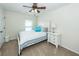 This bedroom has neutral decor, white furniture, and a ceiling fan at 2052 Bancroft Ln, Mount Pleasant, SC 29466