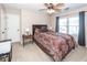 This bedroom features a ceiling fan, and a bed with decorative brown bedding at 2052 Bancroft Ln, Mount Pleasant, SC 29466