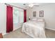 This bedroom features a bed with decorative bedding and red curtains at 2052 Bancroft Ln, Mount Pleasant, SC 29466